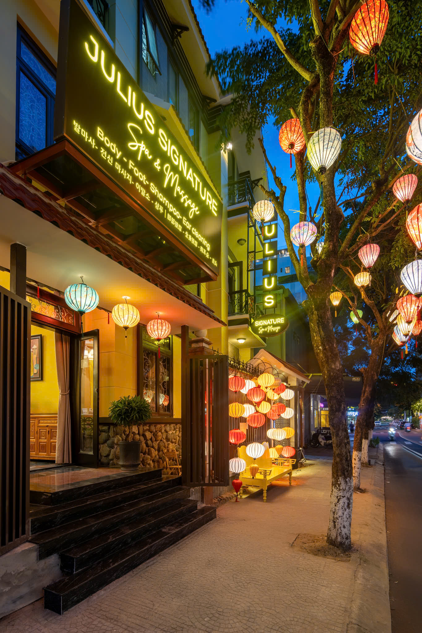 Julius Spa exterior at night with lanterns